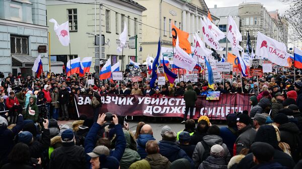 Участники марша памяти политика Бориса Немцова в Москве Участники марша памяти политика Бориса Немцова в Москве