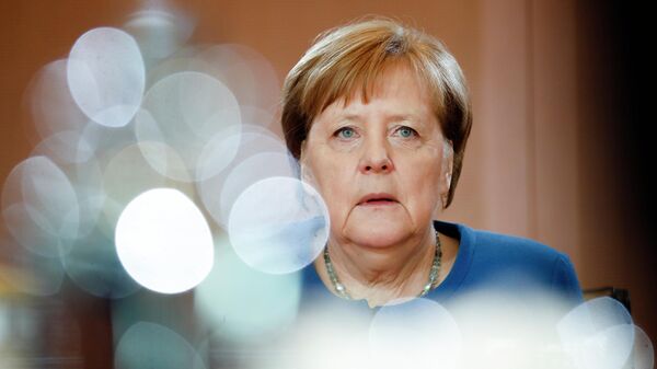 Меркель: данные о хакерской атаке на бундестаг "причиняют боль"