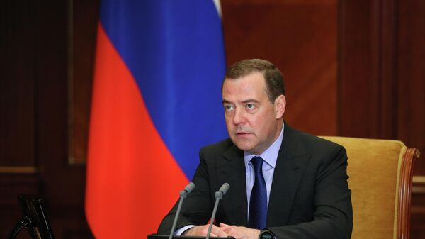 Заместитель председателя Совета безопасности РФ Дмитрий Медведев во время совещания в режиме видеоконференции