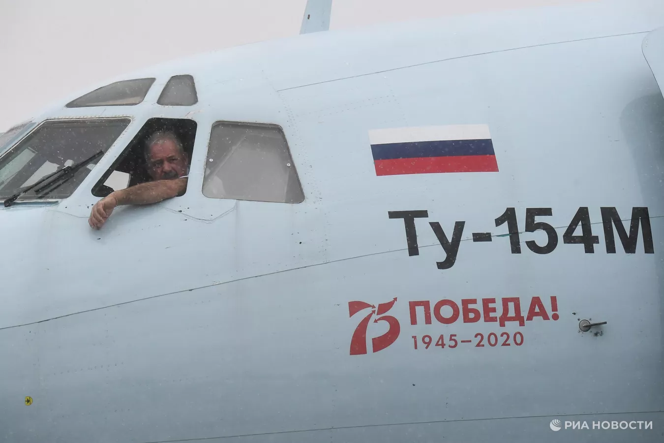 a man looking out of a plane window