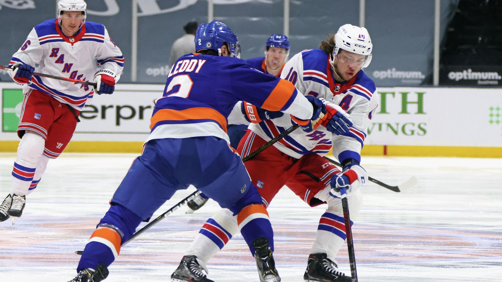 UNIONDALE, NEW YORK - APRIL 09: Artemi Panarin #10 of the New York Rangers carries the puck in on Nick Leddy #2 of the New York Islanders at Nassau Coliseum on April 09, 2021 in Uniondale, New York.   Bruce Bennett/Getty Images/AFP (Photo by BRUCE BENNETT / GETTY IMAGES NORTH AMERICA / Getty Images via AFP) - РИА Новости, 1920, 10.04.2021