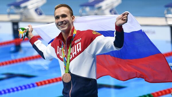 Антон Чупков (Россия), завоевавший бронзовую медаль в плавании на 200 м брассом, на церемонии награждения XXXI летних Олимпийских игр Антон Чупков (Россия), завоевавший бронзовую медаль в плавании на 200 м брассом, на церемонии награждения XXXI летних Олимпийских игр