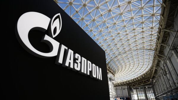 Стенд с логотипом компании Газпром. Архивное фото Стенд с логотипом компании Газпром. Архивное фото