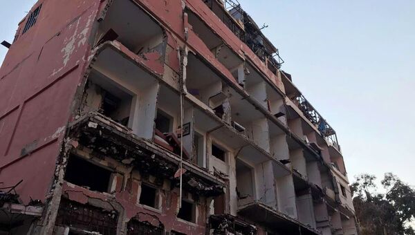 Разрушенные в результате боевых действий дома в жилой части города Пальмира в сирийской провинции Хомс Разрушенные в результате боевых действий дома в жилой части города Пальмира в сирийской провинции Хомс