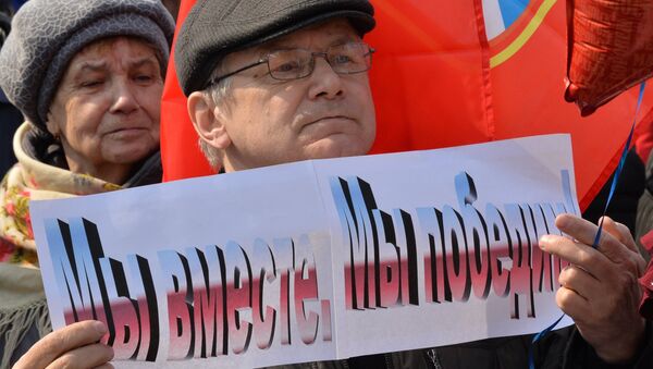 Участник митинга в честь третьей годовщины воссоединения Крыма с Россией во Владивостоке Участник митинга в честь третьей годовщины воссоединения Крыма с Россией во Владивостоке