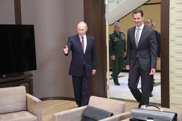 Президент РФ Владимир Путин и президент Сирии Башар Асад во время встречи Президент РФ Владимир Путин и президент Сирии Башар Асад во время встречи