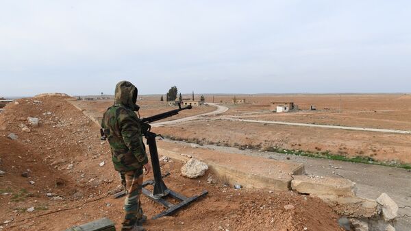 Сирийский военнослужащий в аэропорту Абу-Дхоу в провинции Идлиб, Сирия. Архивное фото Сирийский военнослужащий в аэропорту Абу-Дхоу в провинции Идлиб, Сирия. Архивное фото