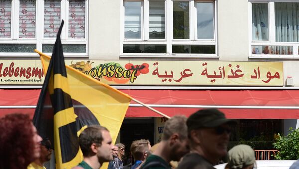 Участники акции против мигрантов в Берлине Участники акции против мигрантов в Берлине
