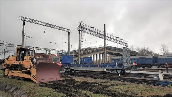 Аварийно-восстановительные работы на месте обрушенного моста в городе Свободном Амурской области Аварийно-восстановительные работы на месте обрушенного моста в городе Свободном Амурской области