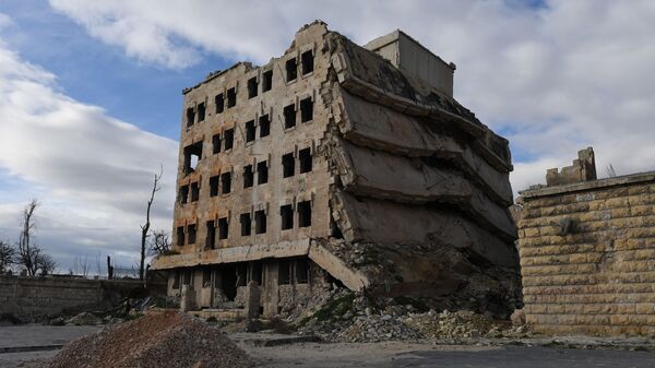 Разрушенные здания в районе Алеппо