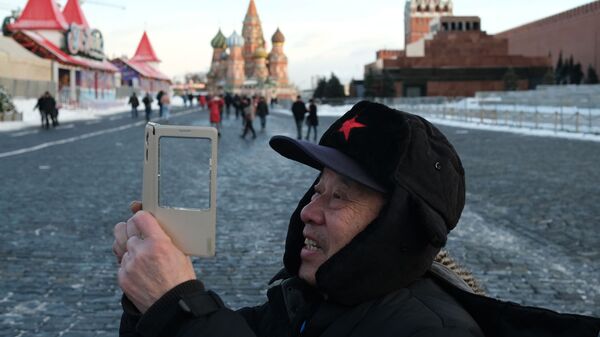 Турист на Красной площади в Москве Турист на Красной площади в Москве