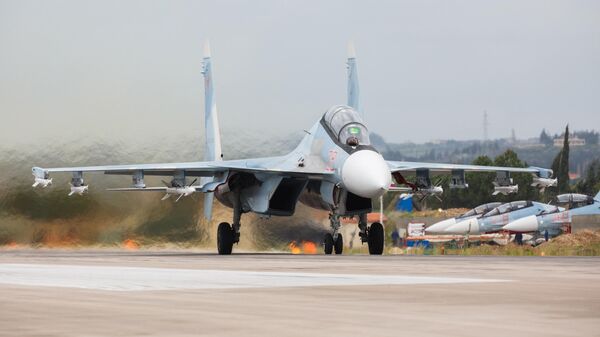 Истребители Су-27 ВКС России на авиабазе Хмеймим в Сирии Истребители Су-27 ВКС России на авиабазе Хмеймим в Сирии
