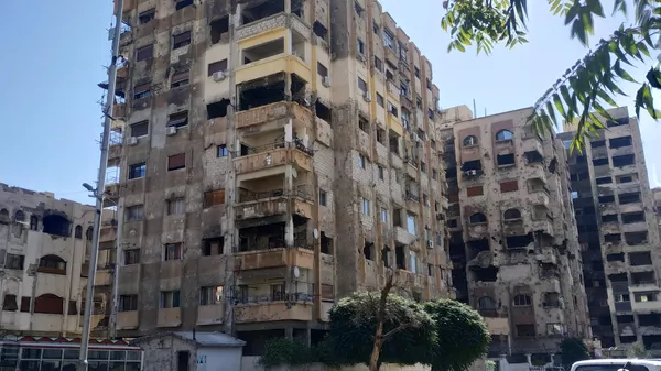 Поврежденные минометным обстрелом дома в районе Барза на востоке Дамаска 