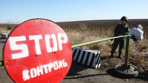 Пропускной пункт в селе Петровское в Донецкой области, где должен состояться отвод сил бойцов подразделений Донецкой народной республики