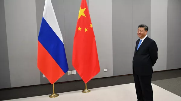 Председатель КНР Си Цзиньпин перед встречей с президентом России Владимиром Путиным