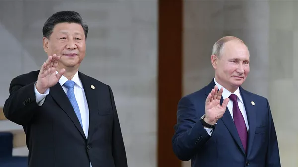 Президент РФ Владимир Путин и председатель КНР Си Цзиньпин на церемонии совместного фотографирования лидеров стран БРИКС