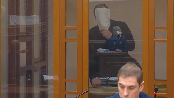 Во время заседания обвиняемые прятали свои лица