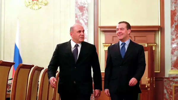Председатель правительства России Михаил Мишустин и заместитель председателя Совета безопасности Дмитрий Медведев во время встречи в Доме правительства